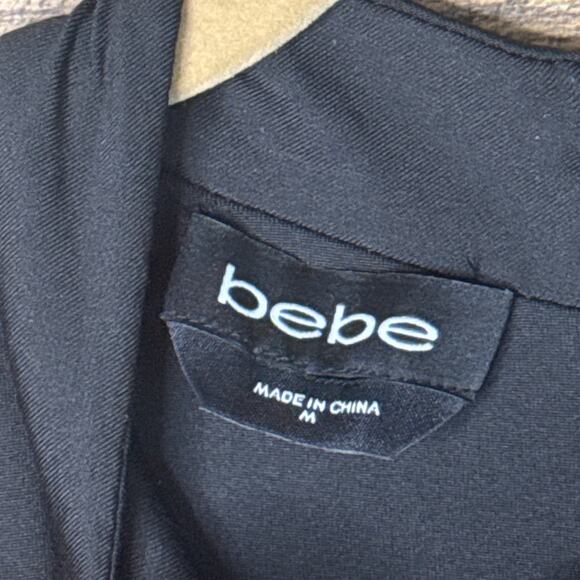 Bebe Gold Bar Detail Jumpsuit Sleeveless Plunging Neckline Black SZ Medium NWT - Picture 4 of 13